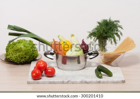 Close-up picture of still life with mixed vegetables isolated on white background. Chef is going to prepare delicious pasta with fresh vegetables.