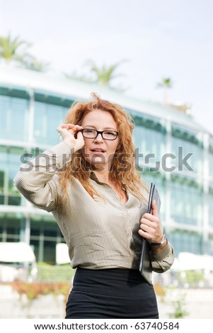 Real office worker posing for camera outdoor