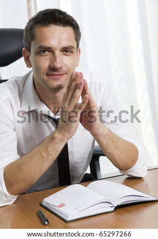 Real office worker posing for camera in Hi Res