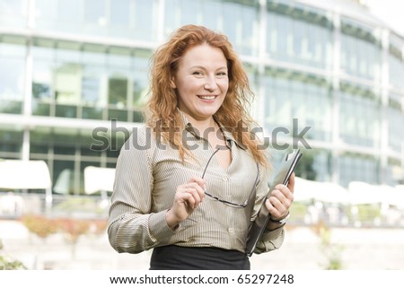 Real office worker posing for camera outdoor