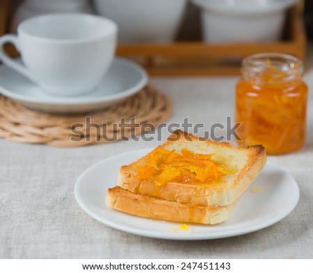 Breakfast of orange marmalade on toast