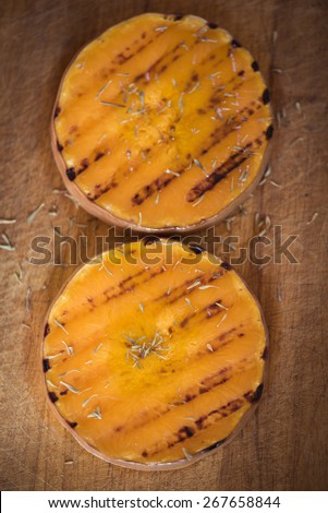 Grilled pumpkin slices with herbs