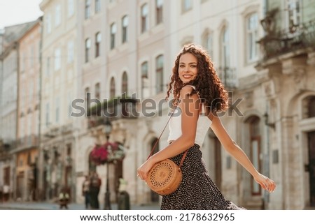 Similar – Image, Stock Photo Playful trendy woman on street in sunshine covering camera with hands