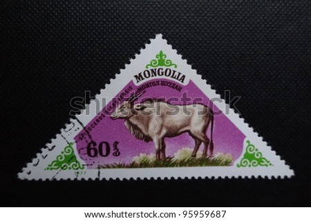 MONGOLIA - CIRCA 1977: A stamp printed in Mongolia shows a prehistoric animal  Spirocerus Kiakhtensis, circa 1977.