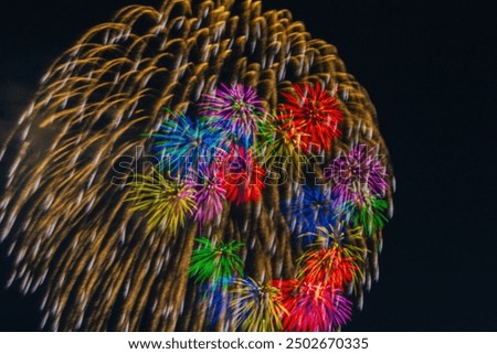 Similar – Image, Stock Photo Fireworks explode in two circles with yellow sparks from red smoke