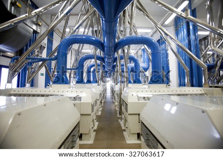 PARMA, ITALY - 3 OCTOBER 2012: Machines cleaning wheat are seen inside a pasta factory.
