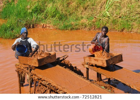 SHINYANGA,TANZANIA CIRCA -MARCH 2010: Gold miners working circa March 18, 2010 in Shinyanga, Tanzania. Tanzania is the third largest gold producer in Africa