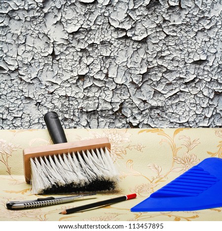 taping of the old wall paper wallpaper and tools for repair