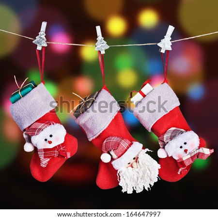 Christmas socks hanging on a background garlands blinking