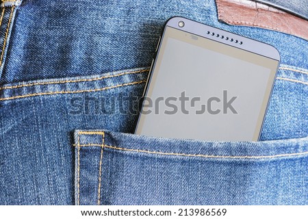 Moscow, Russia -August 26, 2014: HTC Mobile Phone in a jeans pocket. HTC Corporation founded in 1997 by Cher Wang, HT Cho and Peter Chou, the priority was the rapidly developing market of smartphones.