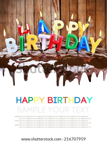 lighted candles on a birthday cake isolated on white background. Empty white space for sample background and text