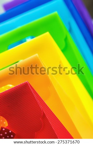 colorful shopping bags background. Focus on the foreground, on a red bag