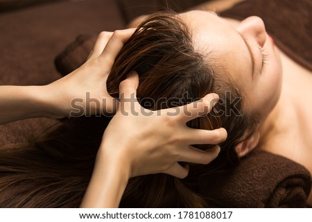 The woman has a head massage.