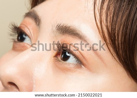 Similar – Image, Stock Photo Young woman with eyes closed standing near wall