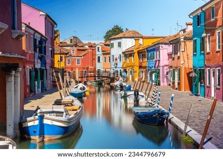 Similar – Image, Stock Photo The gondolas splash in the blue calm water. They are attached to wooden poles.