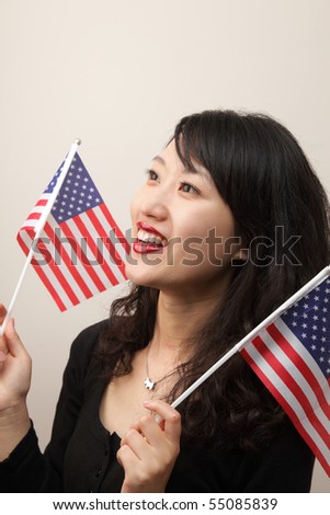 A beautiful young woman with US flags