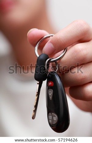 man with a car key in his hand