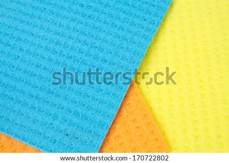 Kitchen towels porous absorbent material in yellow, orange and blue