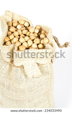 Hemp bag filled with chickpeas on a white background