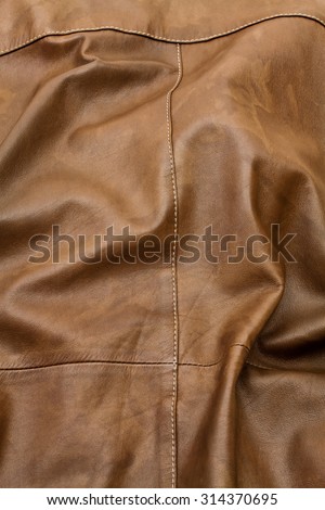 Detail of light brown leather clothing with a distinctive color and texture