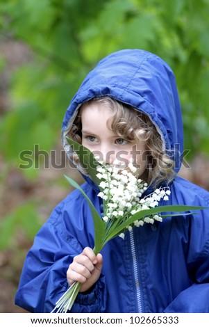 Lovely girl with a bouquet of lily of the valley Imagine de stoc © 