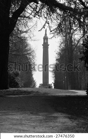 Prospect Tower, Stowe Landscape Gardens, in thin mist, framed by trees and path. B&W