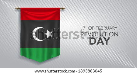 Libya revolution day greeting card, banner, vector illustration. Libyan national day 17th of February background with pennant