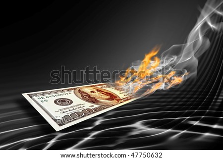 burning one hundred dollars banknote on abstract black background