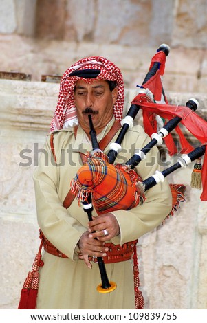 JERASH JORDAN-NOVEMBER 25:Bedouin play bagpipe on November 25 2009 in Jerash Jordan. Bagpipes came an Arab instrument from Scottish troop under British administration from 1922 till 1946.