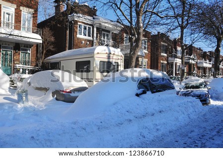 MONTREAL-CANADA DEC. 28:Cars cover of snow on Merose Street. The snow storm slam Montreal with 45 cm of snow, Canada on December 28, 2012 after knocking out power to thousands of homes in the U.S..
