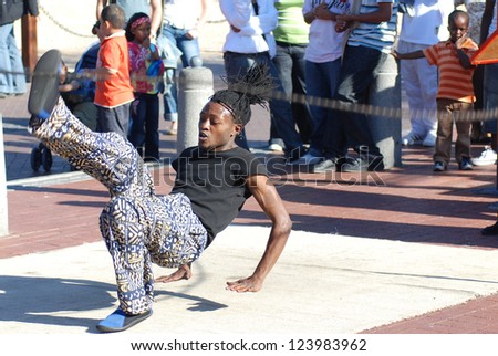 CAPE TOWN - SOUTH AFRICA - MAY 25 : Unidentified young man wears workers clothing, during presentation of soweto street dancing, south african style on May 25, Cape Town, South Africa.