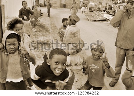 KHAYELITSHA, CAPE TOWN - MAY 22 : A unidentified group of young children play on a street of Khayelitsha township, on May 22, 2007, Cape Town, South Africa Khayelitsha is township in Western Cape, SA