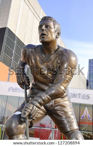MONTREAL CANADA FEBRUARY 03: Statue of Jean Beliveau former hockey player in front the Bell Center on february 03 2013 in Montreal Canada. He was inducted into the Hockey Hall of Fame in 1972.