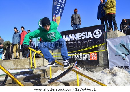 MONTREAL CANADA FEBRUARY 17: Unidentified participant in snowboarding at the Barbegazi Winter Extreme Sports Festival in front the Olympic Stadium on February 17 2013 in Montreal Canada