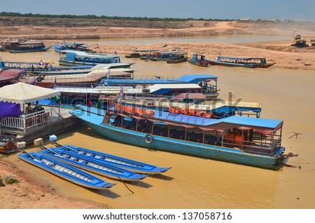 TONLE SAP CAMBODIA LAKE MARCH 31:Tourists boats on the Tonle sap River is a combined lake and river system of major importance to Cambodia on march 31 2013 in Tonle Sap Lake, Cambodia.