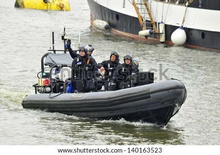 LONDON, UK-JUNE 1: Police boats watching on Thames river during the Queen\'s Diamond Jubilee celebrations on June 1, 2012 in London England, UK