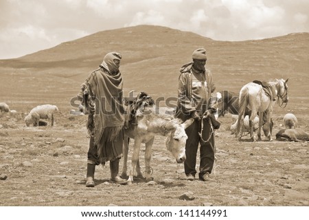 LESOTHO - NOV 25: Sotho men in small village on November 25 2009, Lesotho, Africa, The Sotho people (or Basotho), an African ethnic group principally resident in South Africa and Lesotho.
