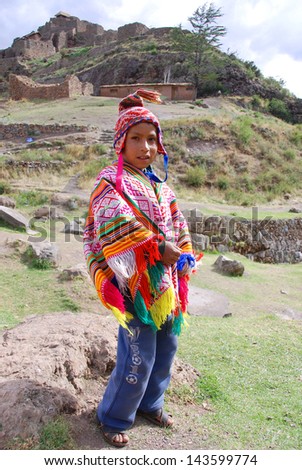 CUSCO PERU - NOVEMBER 26: Portrait of unidentified child in traditional clothing, on November 5, 2010 in Cusco, Peru. Some children have to walk 2 hours a day for to go school in Peruvian mountain.