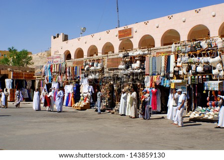 KARNAK EGYPT NOVEMBER 26:Men sale souvenirs in typical street market on november 26 2009 Karnak Egypt. More than 20 percent of Egypts 76 million people live below the poverty line.
