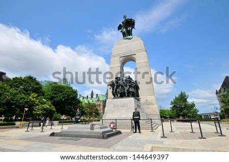 OTTAWA, CANADA - JUNE 30: The National War Memorial , is a tall granite cenotaph with acreted bronze sculptures, that stands in Confederation Square, June 30, 2013 in Ottawa, Ontario Canada