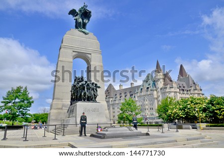 OTTAWA, CANADA - JUNE 30: The National War Memorial , is a tall granite cenotaph with acreted bronze sculptures, that stands in Confederation Square, June 30, 2013 in Ottawa, Ontario.
