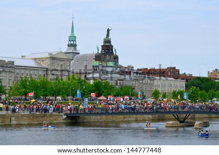 MONTREAL CANADA JULY 01: Crowd during Canada Day celebration in Old port of Montreal on july 01 2013 in Montreal Canada