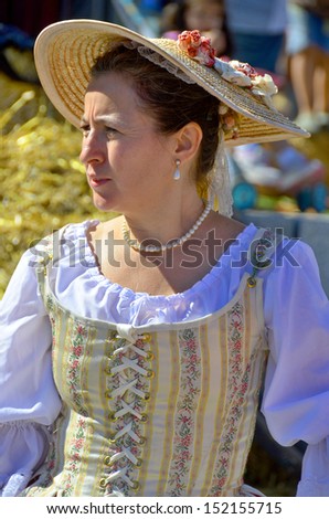 MONTREAL QUEBEC CANADA AUGUST 24: Woman  re-enacting New France era in Old Montreal, Pointe-a-Calliere\'s 18th Century Public Market on august 24 2013 in Montreal Canada