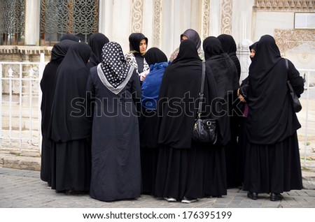 ISTANBUL, TURKEY - OCTOBER 08: Muslim veiled women in the heart of downtown Istanbul on october 08 2013. The Turkish government banned women who wear headscarves from working in the public sector.