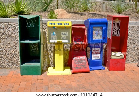 TUCSON ARIZONA APRIL 24: Row of colorful  typical american newspaper boxes downtown Tucson on april 24 2014 in Tucson Arizona