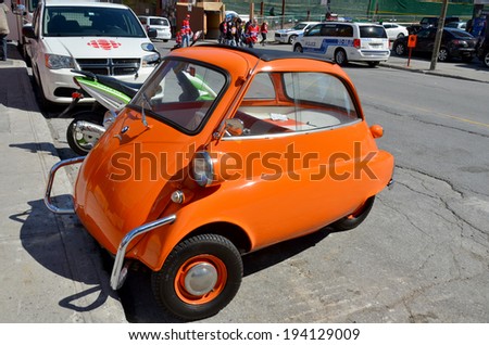 MONTREAL CANADA MAY 19: BMW Isetta was the world's first mass-production 3-Litres car. Was the top-selling single-cylinder car in the world, with 161,728 units sold. On may 18 2014 in Montreal Canada