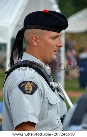 MONTREAL CANADA AUGUST 03:  Royal Canadian Mounted Police (RCMP), literally \'Royal Gendarmerie of Canada is both a federal and a national police force of Canada on 08 03 2014 in Montreal Canada.