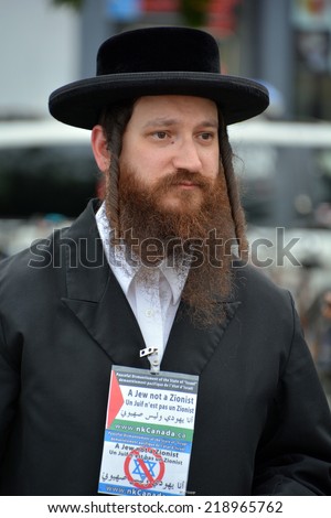MONTREAL CANADA AUGUST 21:Unidentified man from jewish Hasidic Orthodox Judaism, participating in a rally to condemn the Israel occupation an bombing on Gaza On 08 21 2014 in Montreal Quebec Canada