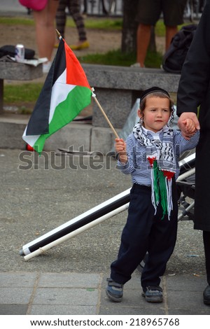 MONTREAL CANADA AUGUST 21:Unidentified kid from jewish Hasidic Orthodox Judaism, participating in a rally to condemn the Israel occupation an bombing on Gaza On 08 21 2014 in Montreal Quebec Canada
