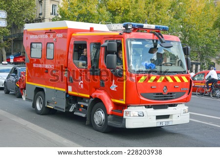 PARIS, FRANCE OCTOBER 16: Fire Truck on the street of Paris downtown on october 16, 2014. The Paris Fire Brigade , is a French Army unit which serves as the fire service for Paris.